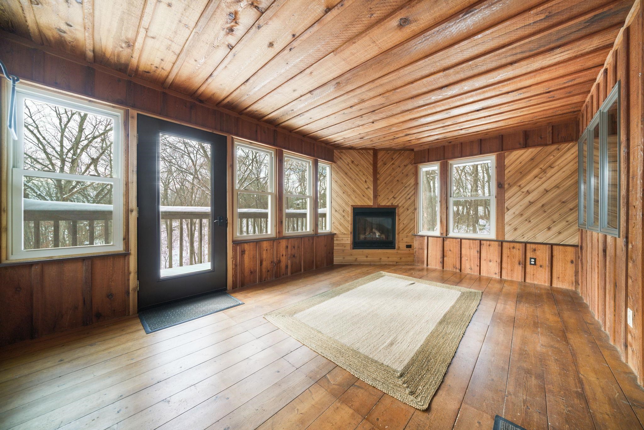 1203 West Mud Creek Road Oregon, IL 61061 - Photo 59 of 67 a view of an empty room with wooden floor and a window