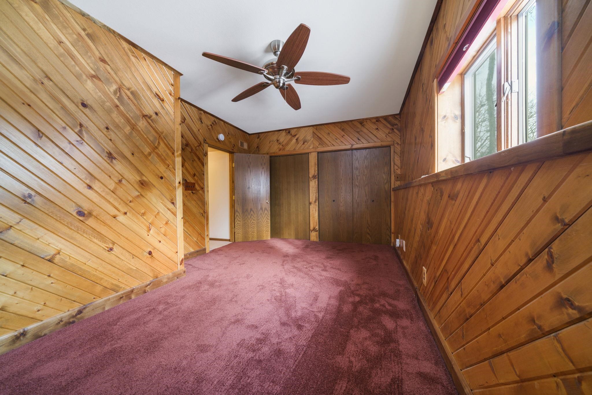 1203 West Mud Creek Road Oregon, IL 61061 - Photo 8 of 67 a view of an empty room with wooden floor and a window