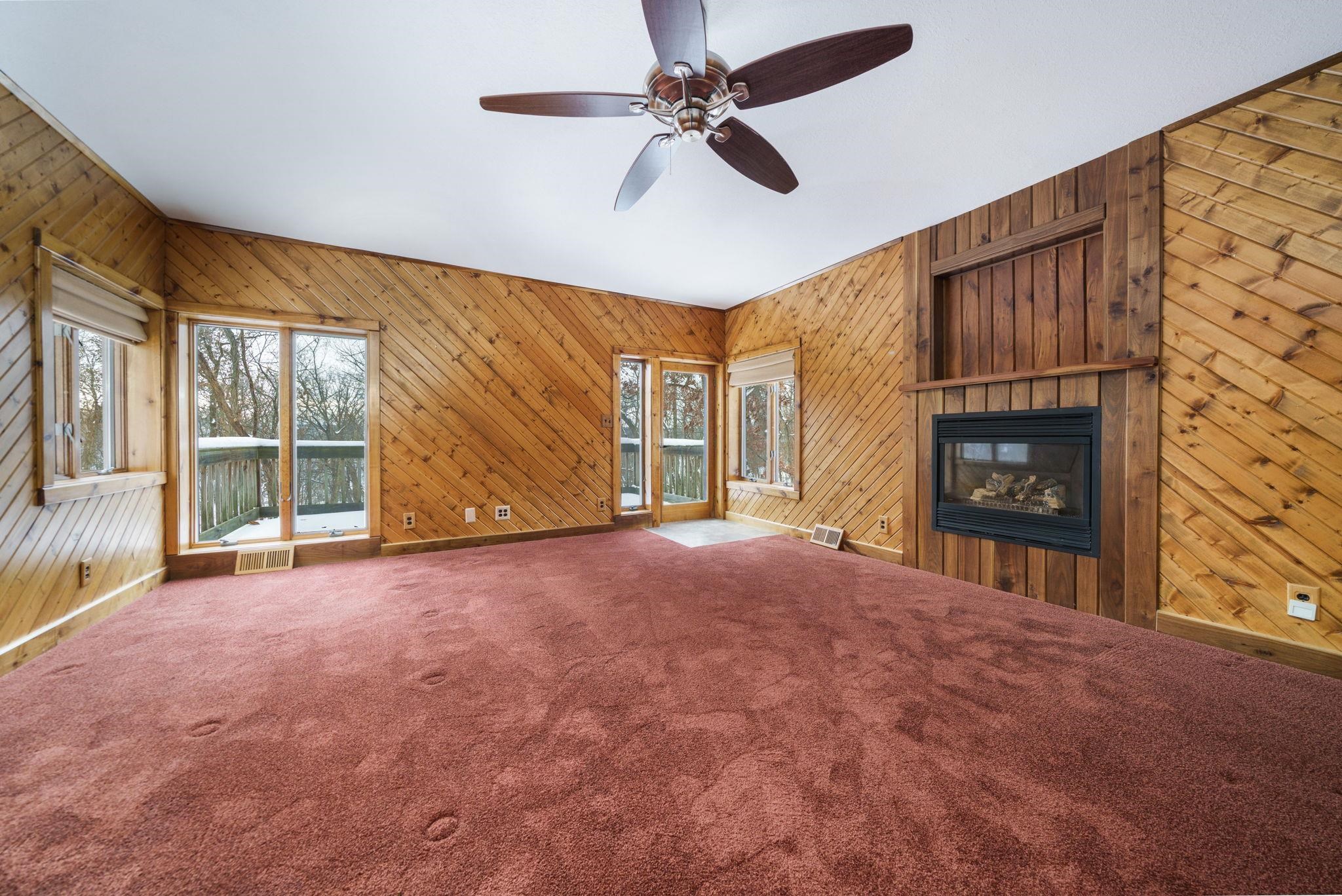 1203 West Mud Creek Road Oregon, IL 61061 - Photo 9 of 67 a view of an empty room with a fireplace and a window