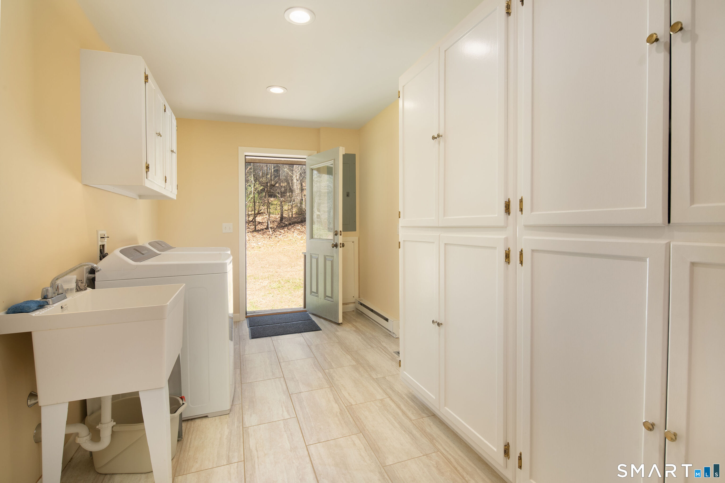 150 Sunset Ridge Road Norfolk, CT 06058 - Photo 32 of 34 Laundry Room/Mud Room off of Kitchen, work sink, storage cabinets, with doors to Garage and side exterior entrance