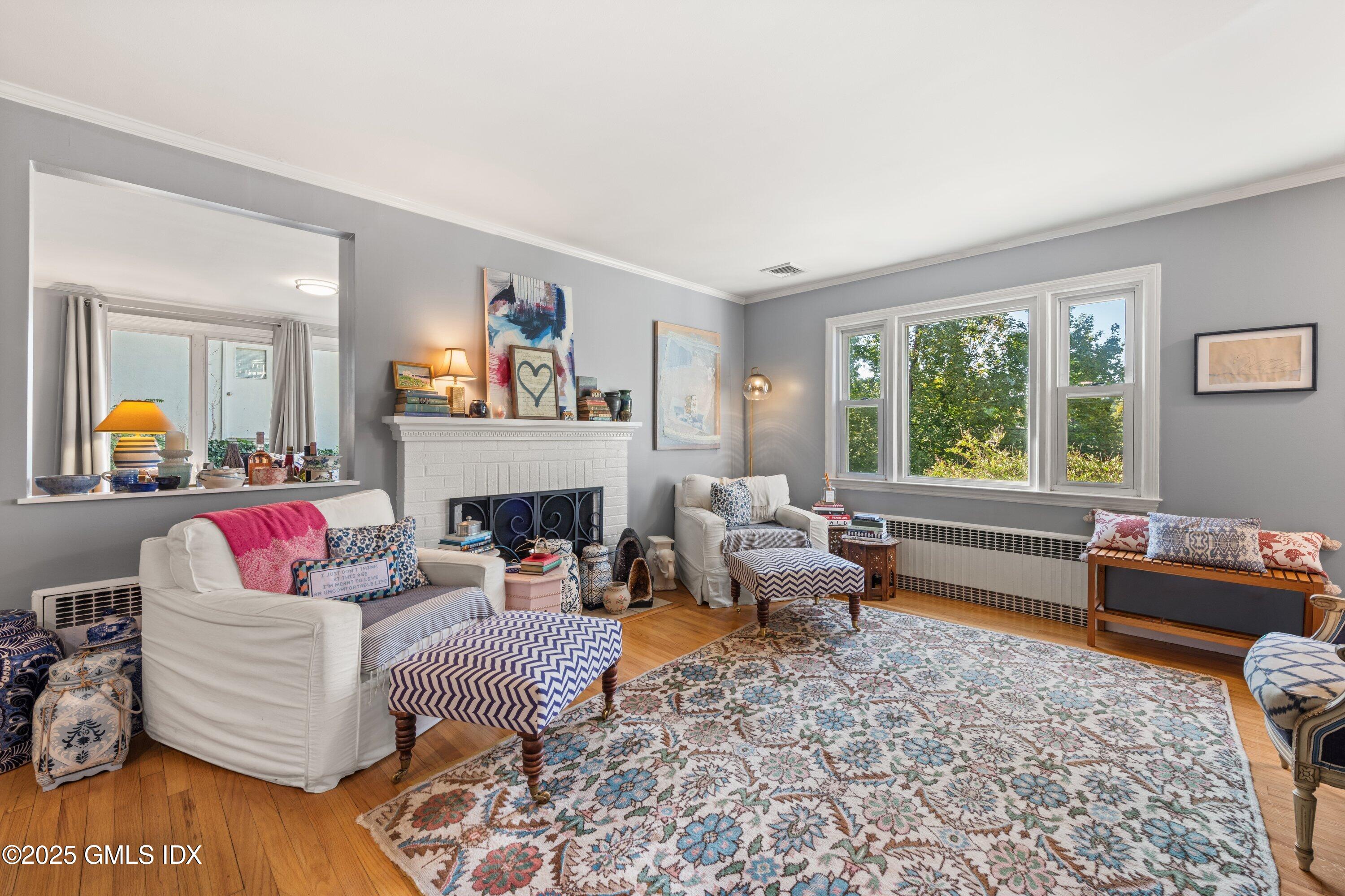 3 Green Lane Greenwich, CT 06831 - Photo 11 of 24 a living room with furniture and a fireplace