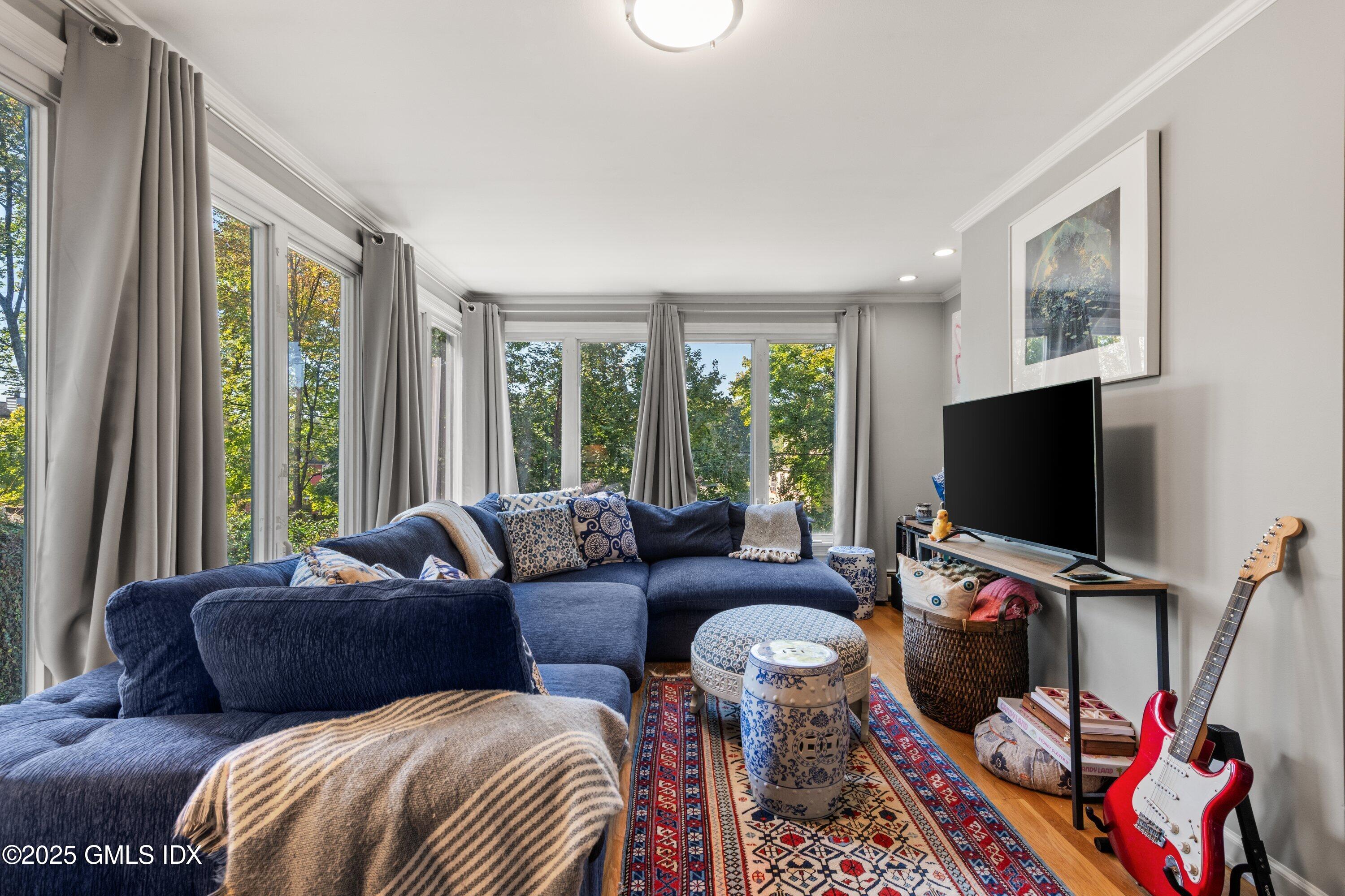 3 Green Lane Greenwich, CT 06831 - Photo 15 of 24 a living room with furniture and a flat screen tv
