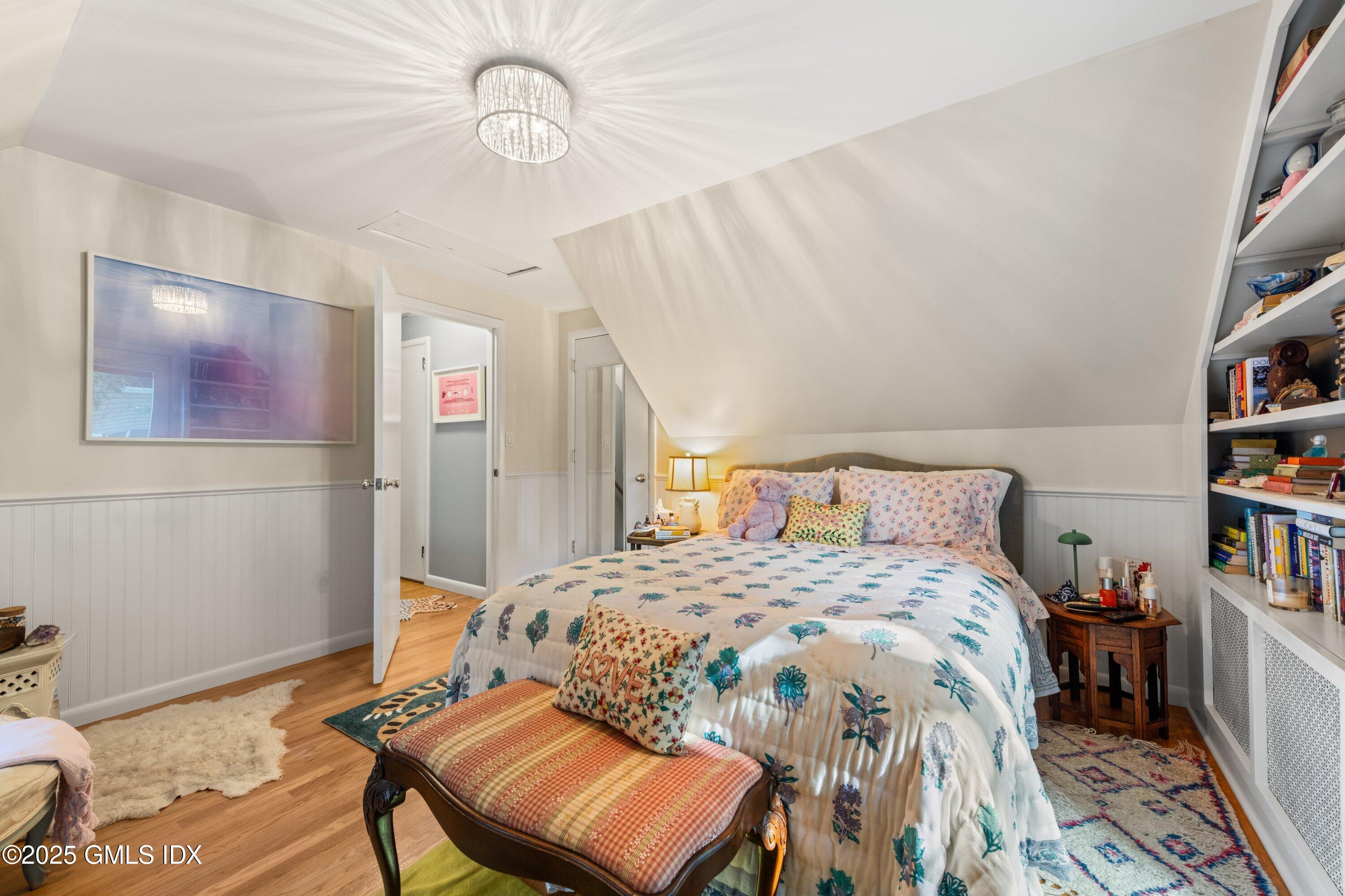 3 Green Lane Greenwich, CT 06831 - Photo 22 of 24 a bedroom with a bed and a book shelf