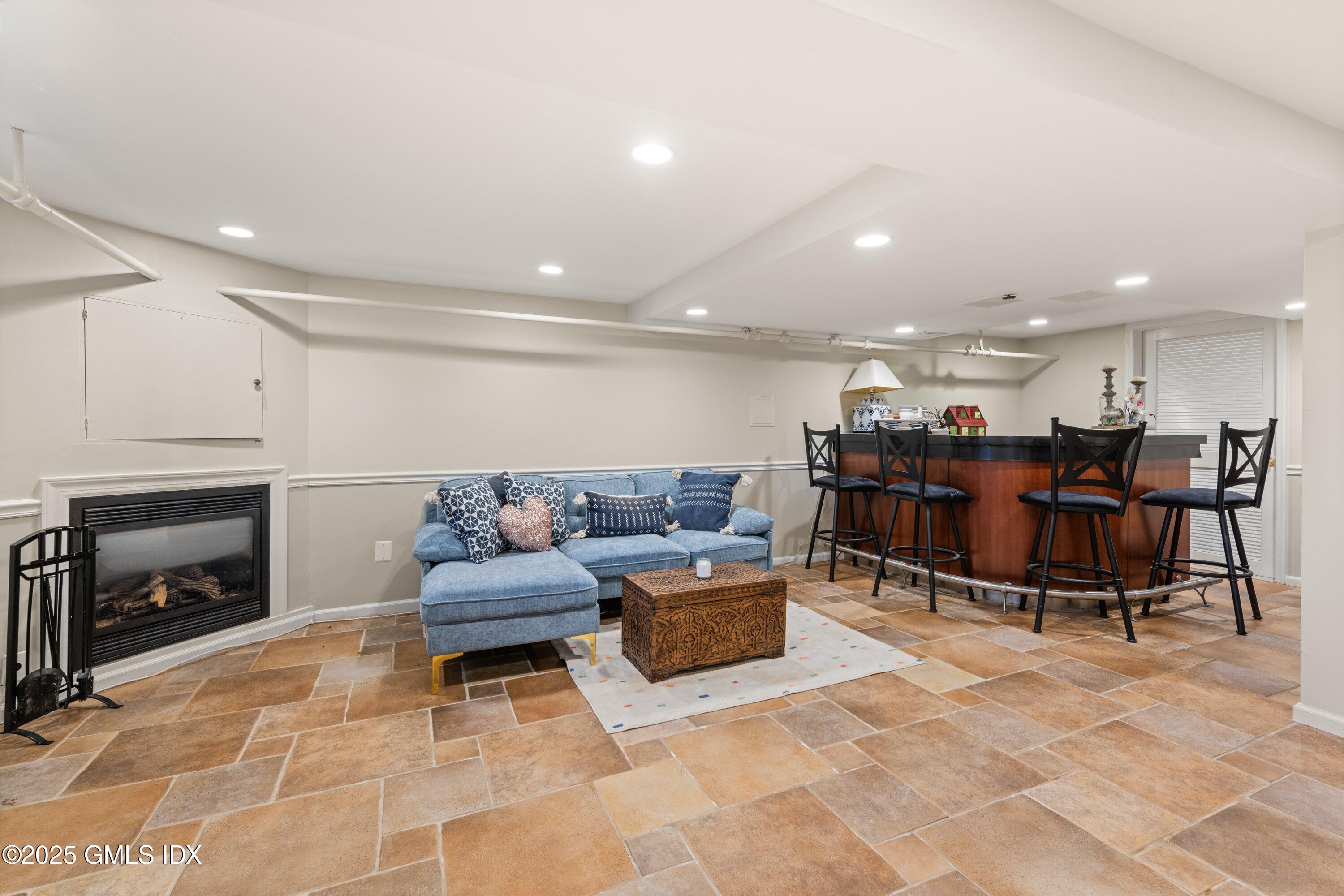 3 Green Lane Greenwich, CT 06831 - Photo 23 of 24 a living room with furniture and a fireplace