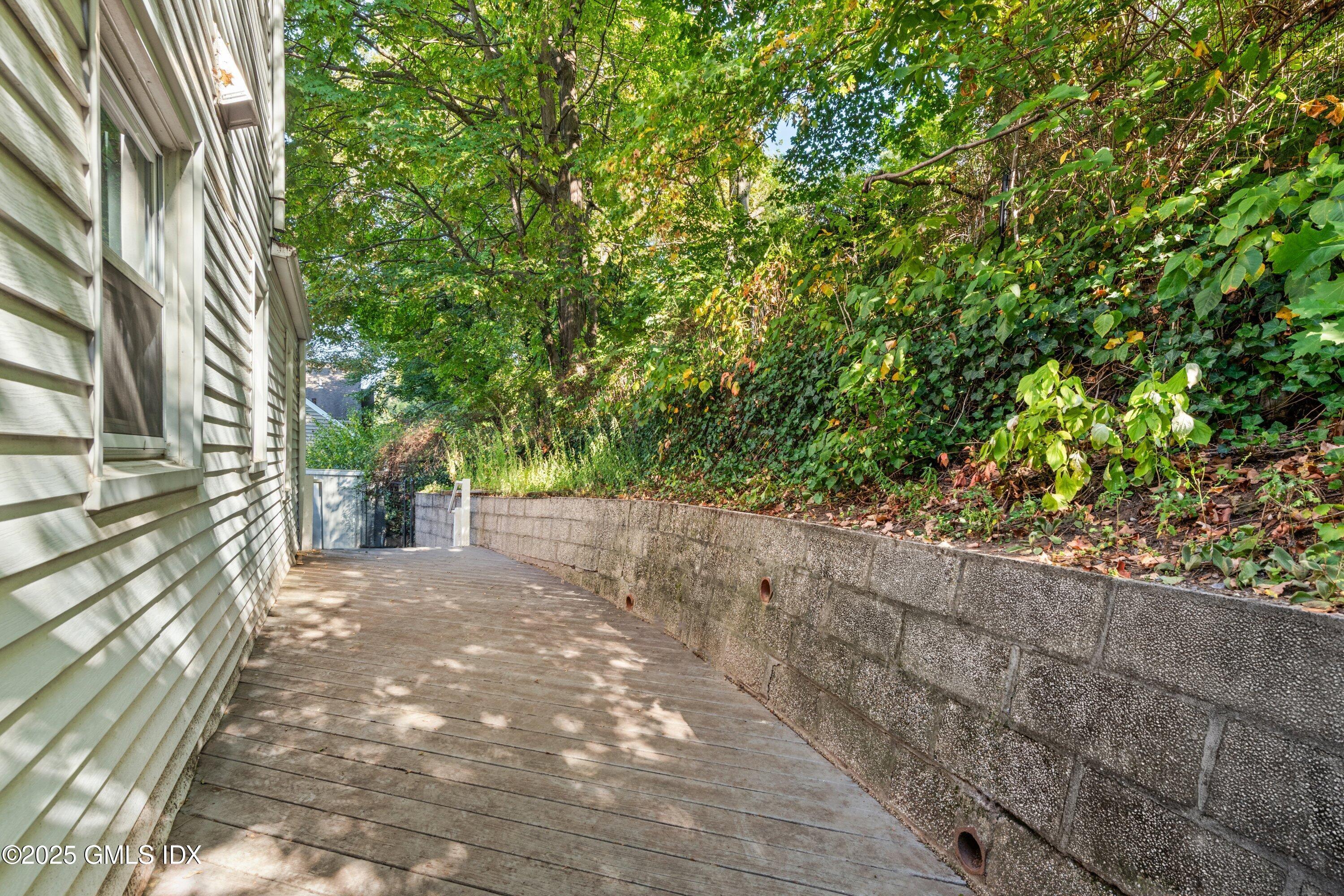 3 Green Lane Greenwich, CT 06831 - Photo 5 of 24 a view of a yard with plants and trees