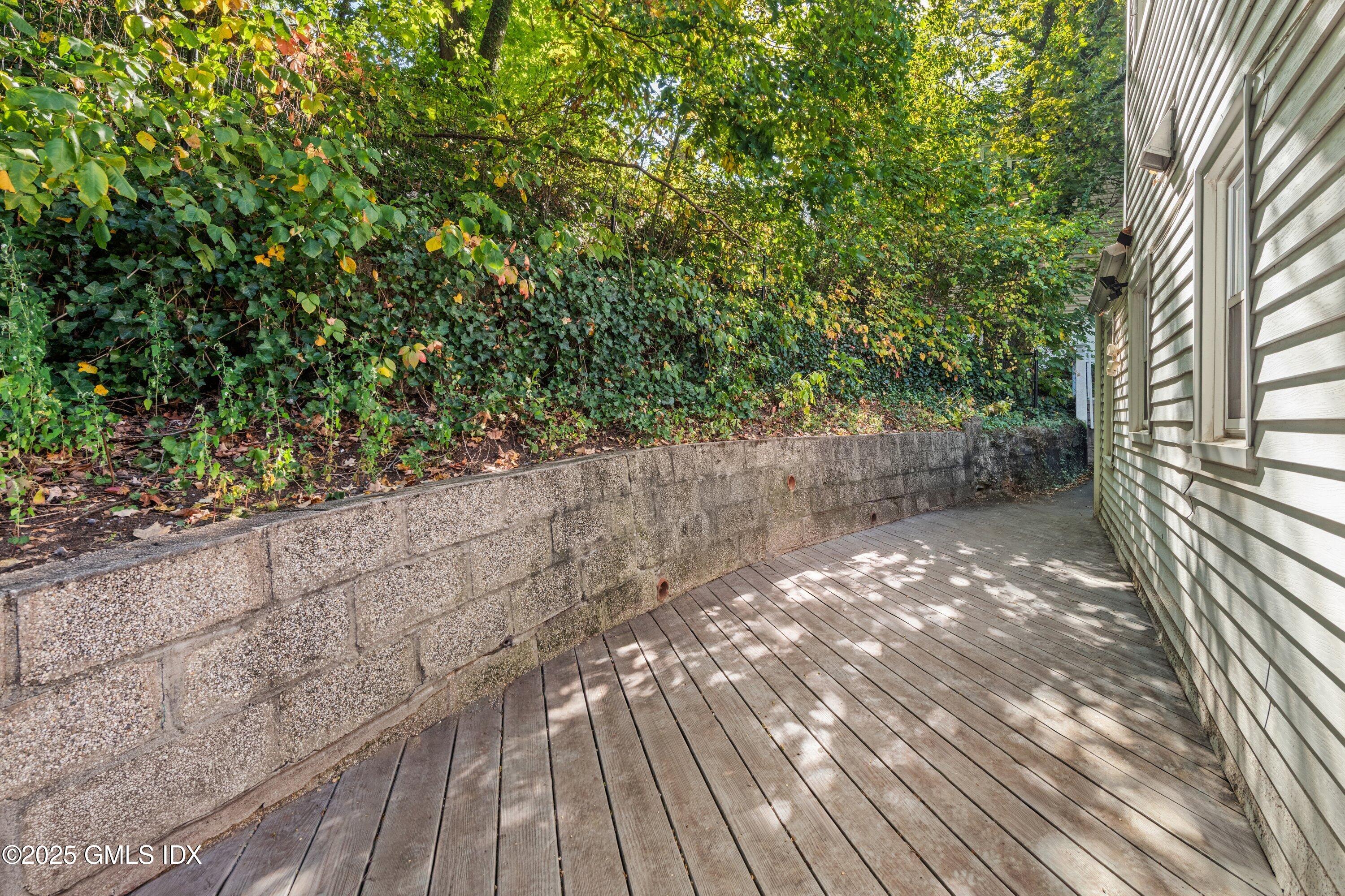 3 Green Lane Greenwich, CT 06831 - Photo 6 of 24 a view of yard with wooden floor