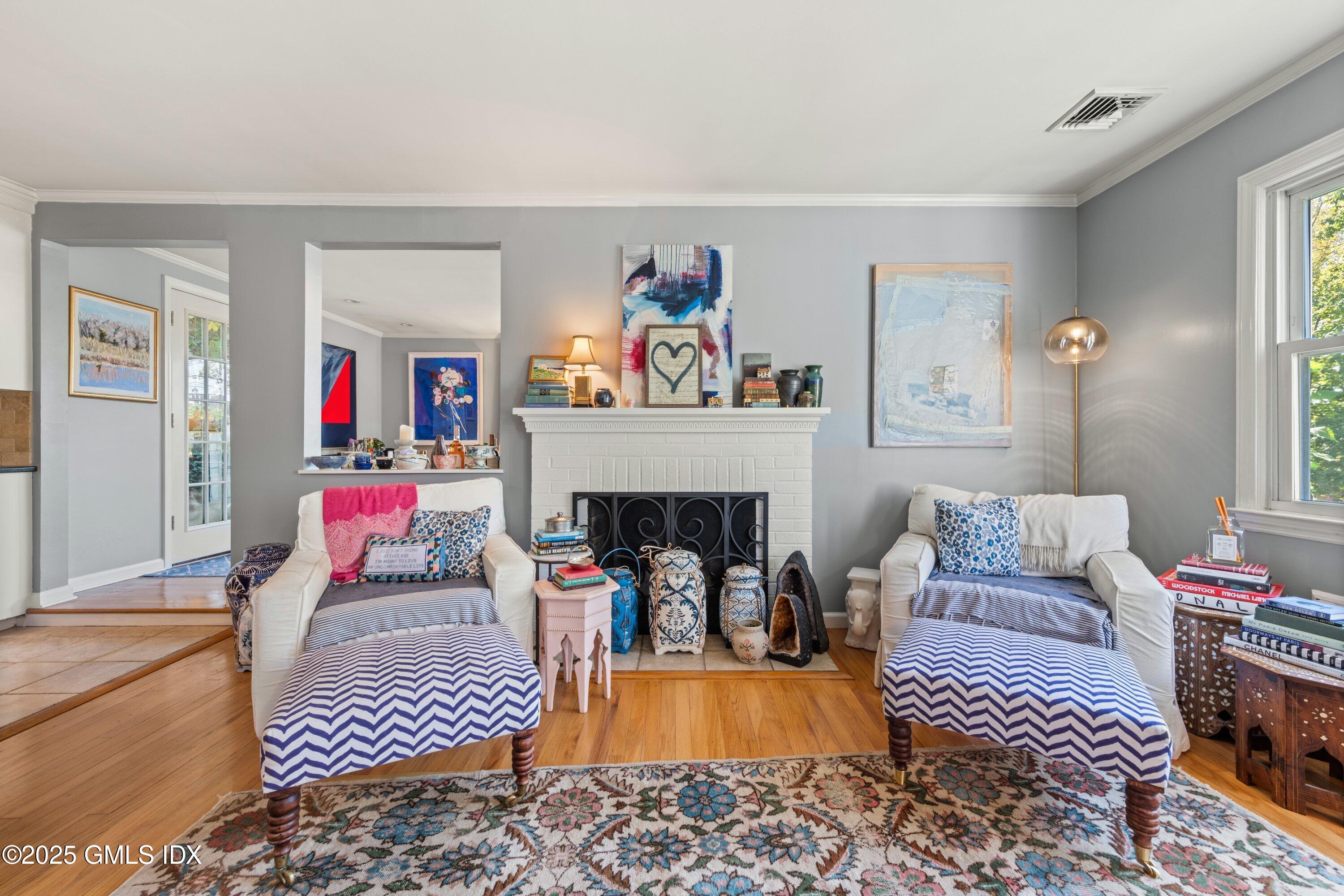 3 Green Lane Greenwich, CT 06831 - Photo 10 of 24 a living room with furniture and a fireplace
