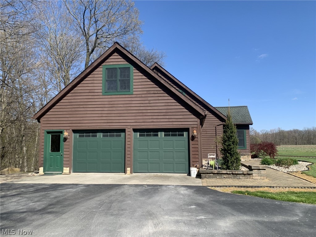 2915 State Rte 113 West Monroeville, OH 44847 - Photo 2 of 50 View of side of property featuring oversized attached 2 car garage