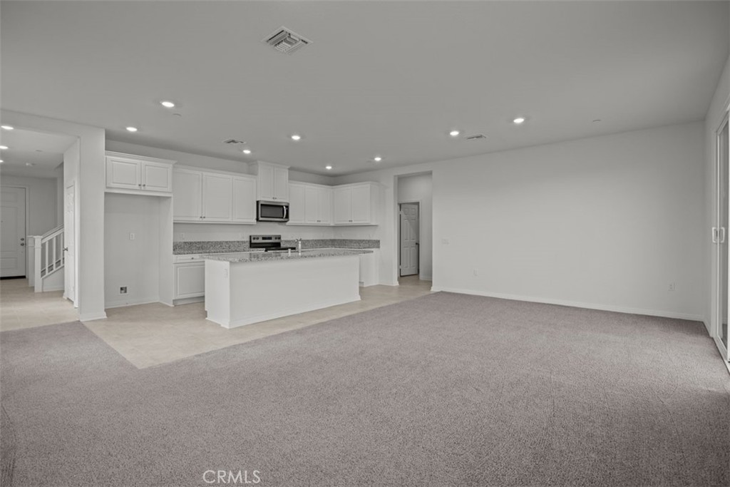 25632 Ranch House Road Homeland, CA 92548 - Photo 15 of 26 a view of a kitchen with a sink and a refrigerator