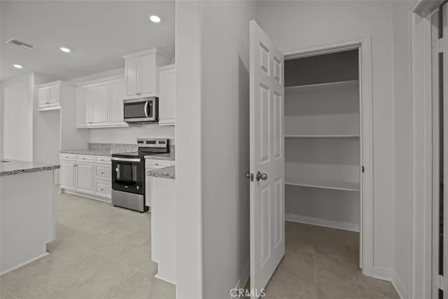 a bathroom with a shower sink vanity and mirror