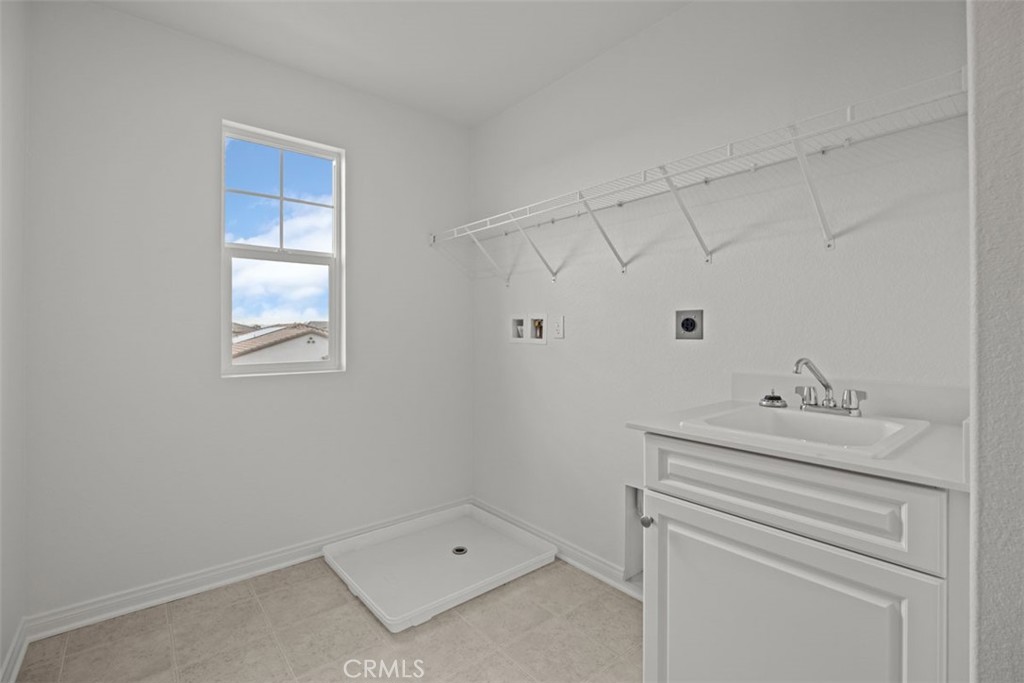 25632 Ranch House Road Homeland, CA 92548 - Photo 26 of 26 a bathroom with a sink toilet vanity and tub