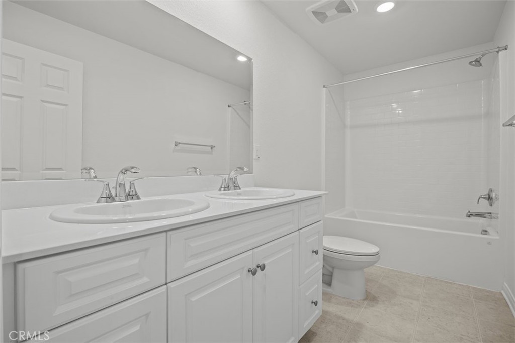 25632 Ranch House Road Homeland, CA 92548 - Photo 3 of 26 a bathroom with a sink a toilet and bathtub