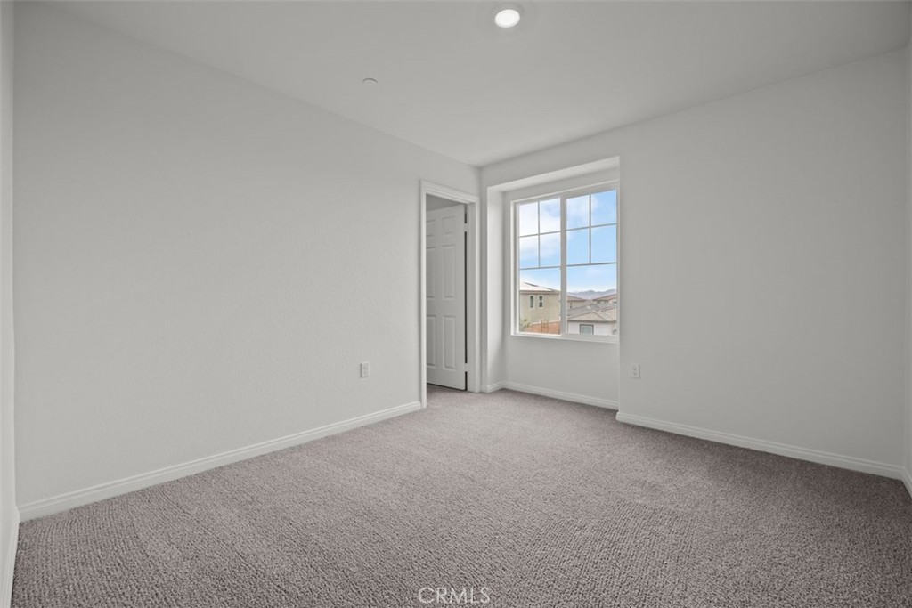 25632 Ranch House Road Homeland, CA 92548 - Photo 8 of 26 a view of an empty room with a window