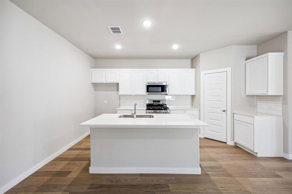308 Millwood Road Lavon, TX 75166 - Photo 8 of 33 Kitchen in the Willow home plan by Trophy Signature Homes – REPRESENTATIVE PHOTO