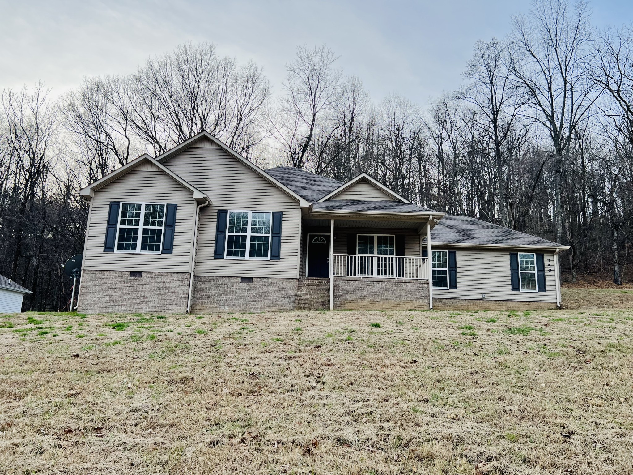 750 Bunker Hill Road Pulaski, TN 38478 - Photo 2 of 36 a front view of a house with a garden