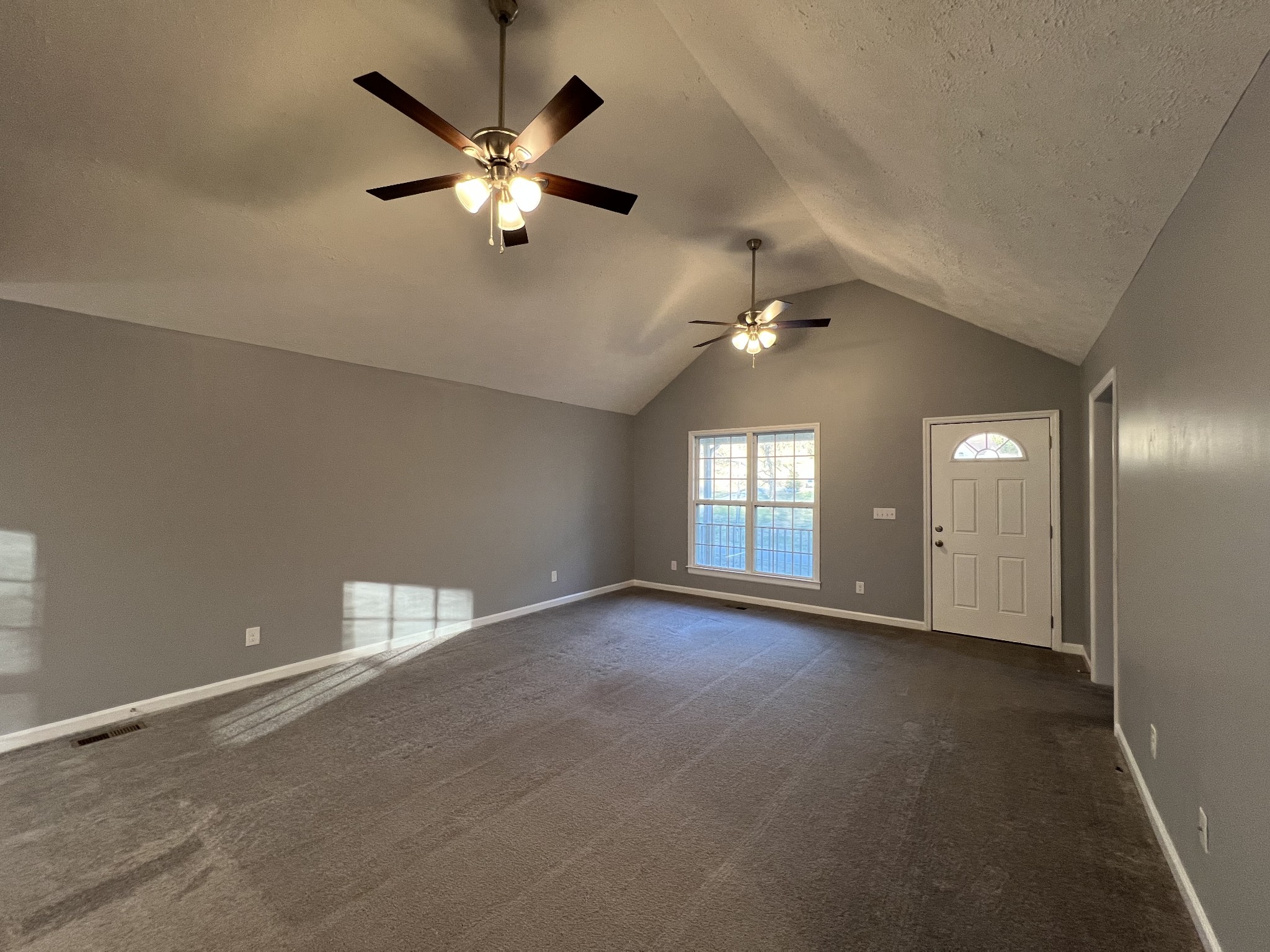 750 Bunker Hill Road Pulaski, TN 38478 - Photo 23 of 36 a view of an empty room with a ceiling fan and window