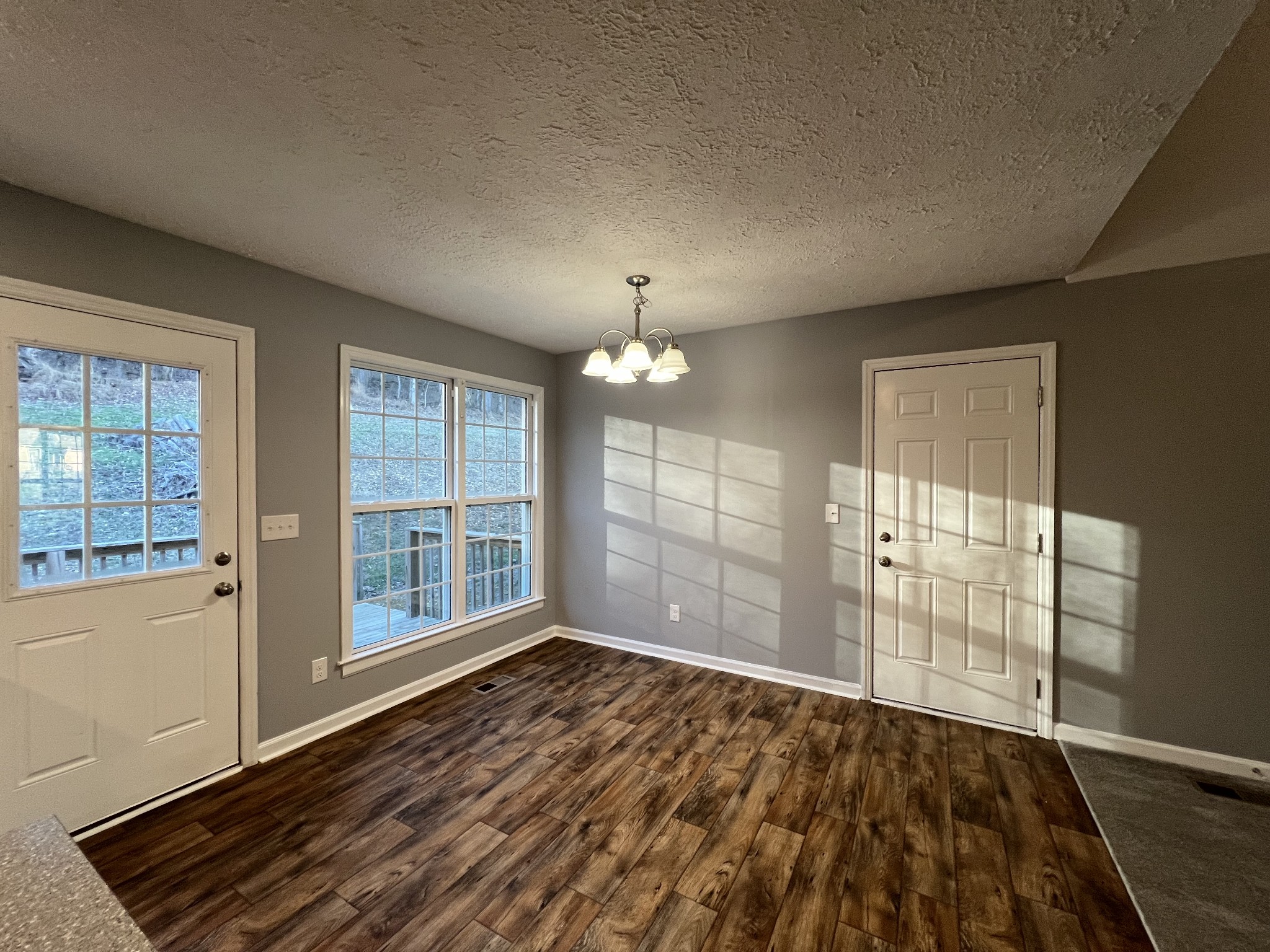 750 Bunker Hill Road Pulaski, TN 38478 - Photo 27 of 36 an empty room with wooden floor and windows