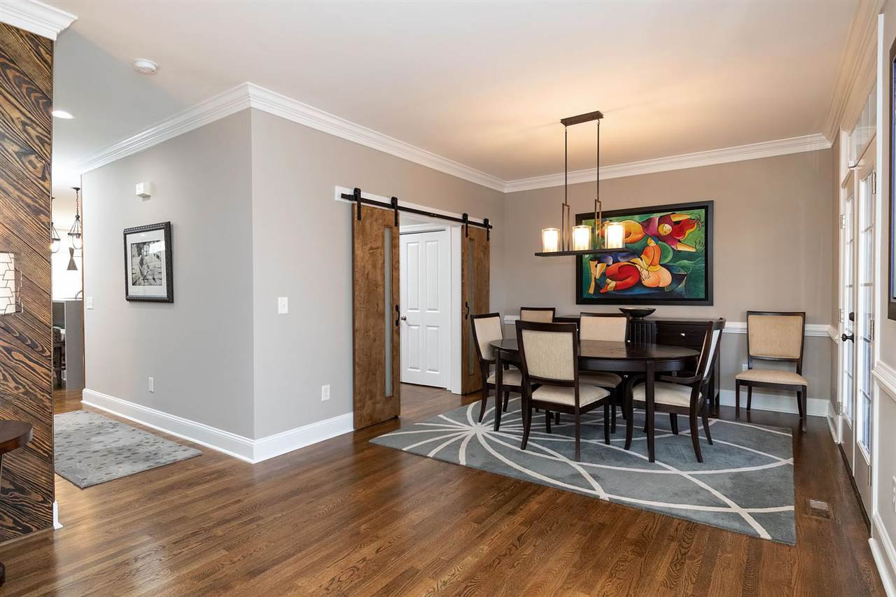 1112 Harp Street Raleigh, NC 27604 - Photo 11 of 25 a view of a dining room with furniture window and wooden floor