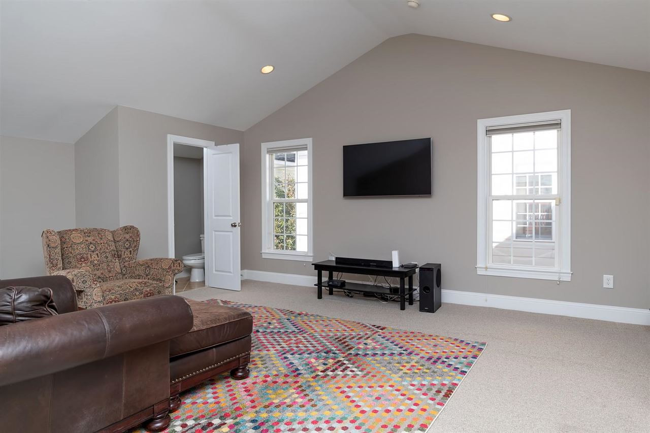 1112 Harp Street Raleigh, NC 27604 - Photo 17 of 25 a living room with furniture and a flat screen tv