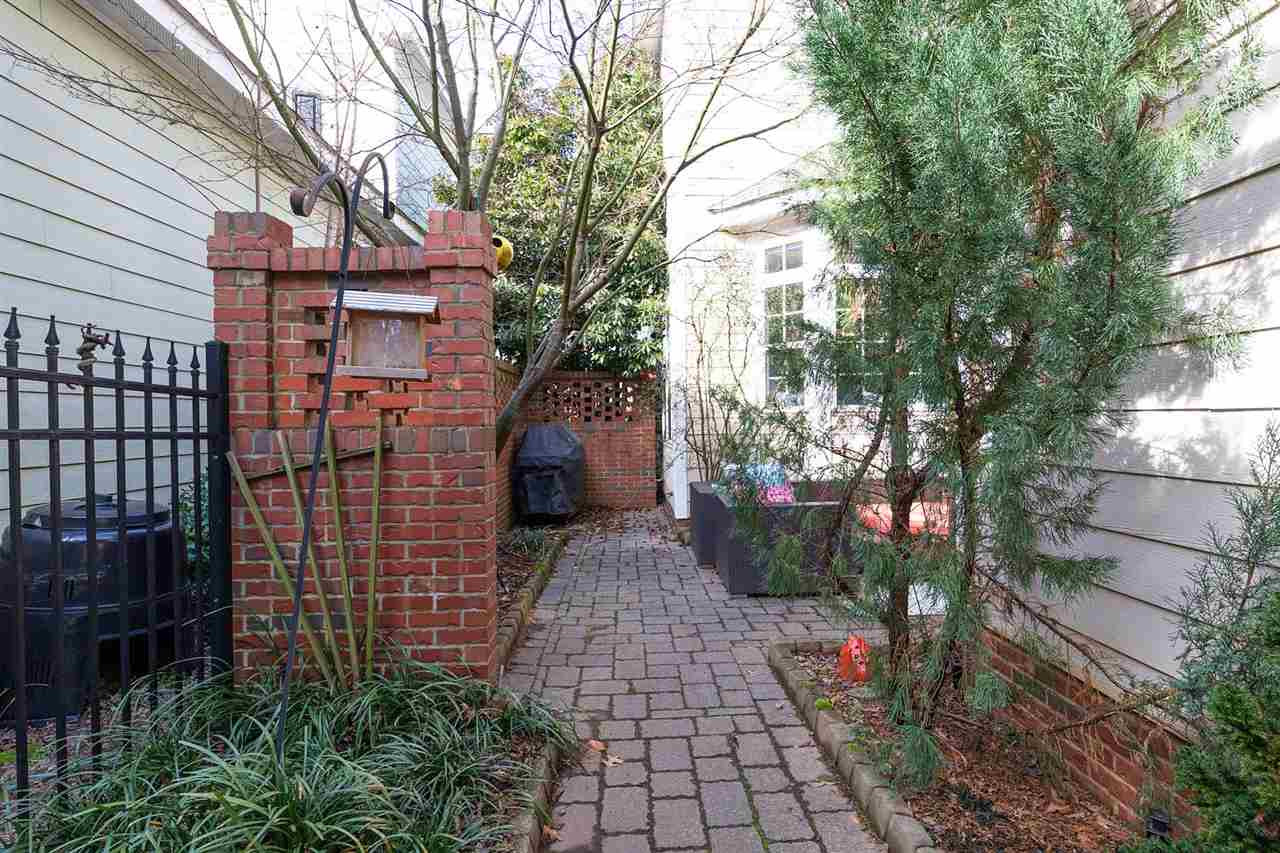 1112 Harp Street Raleigh, NC 27604 - Photo 19 of 25 a pathway of a house with a yard