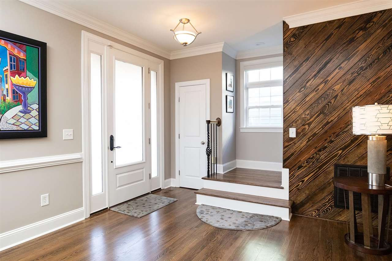 1112 Harp Street Raleigh, NC 27604 - Photo 2 of 25 a view of front door with wooden floor and stairs