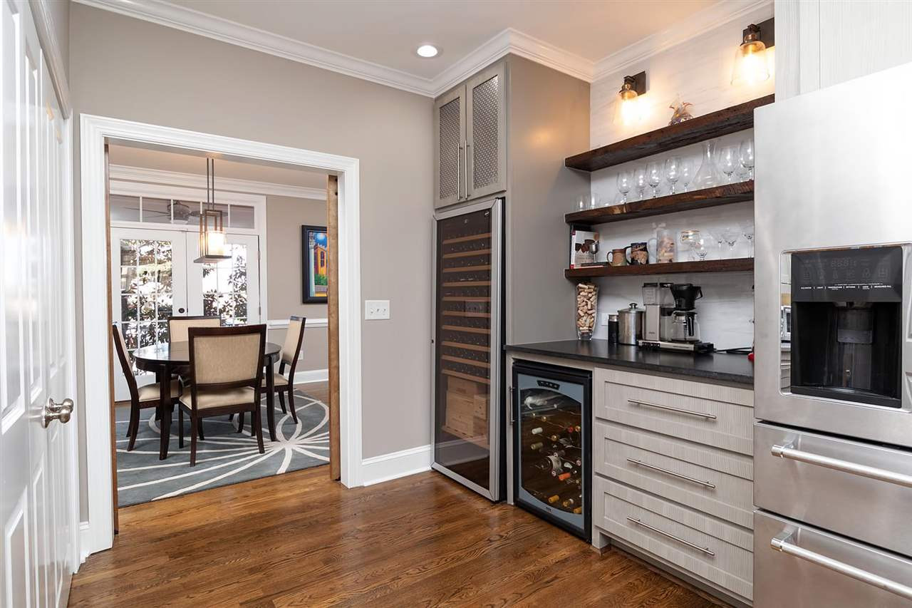 1112 Harp Street Raleigh, NC 27604 - Photo 9 of 25 a kitchen with stainless steel appliances granite countertop a stove and a refrigerator