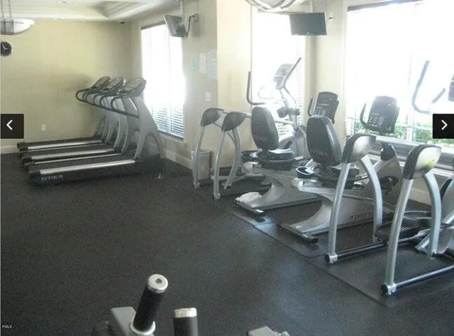 a view of swimming pool with outdoor seating and lake view