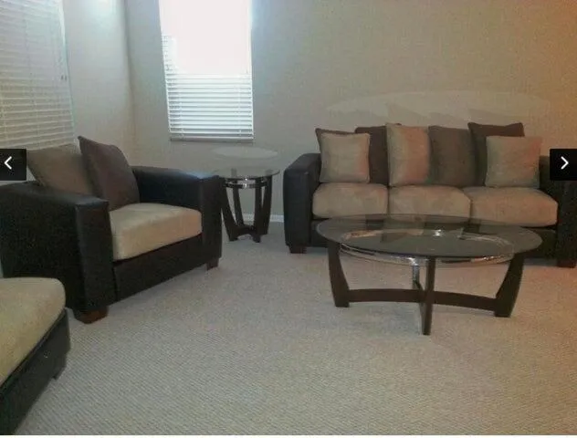 a living room with furniture and a window