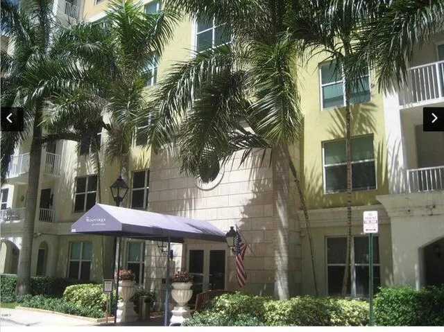 a view of a brick building with a yard