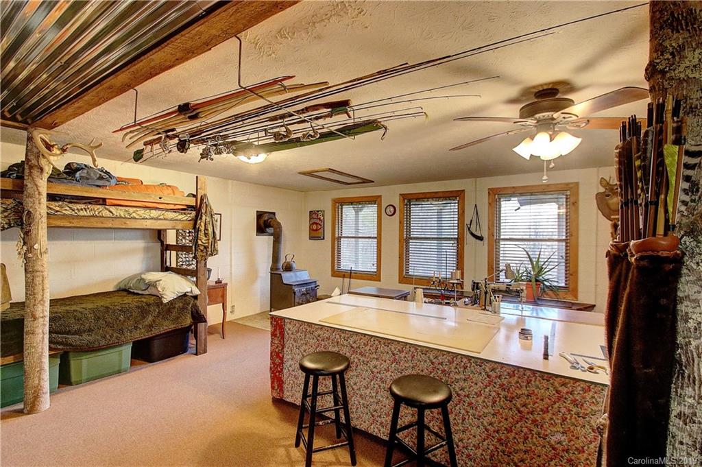 951 Price Town Road Clyde, NC 28721 - Photo 15 of 36 a dining hall with a stove a faucet and a refrigerator