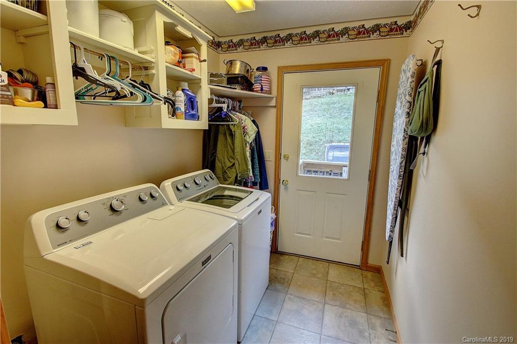951 Price Town Road Clyde, NC 28721 - Photo 16 of 36 a utility room with dryer and washer