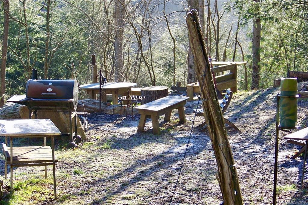 951 Price Town Road Clyde, NC 28721 - Photo 27 of 36 a view of a backyard with sitting area