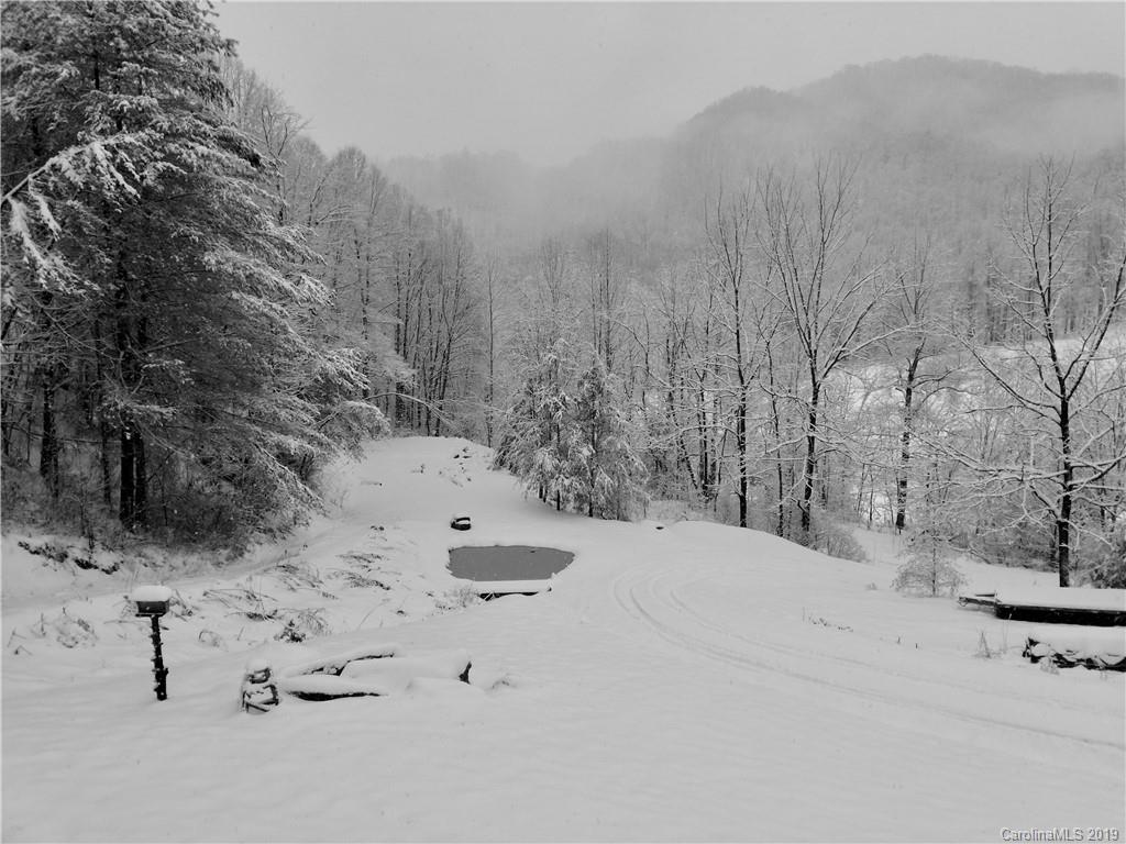 951 Price Town Road Clyde, NC 28721 - Photo 33 of 36 a view of white house covered in snow