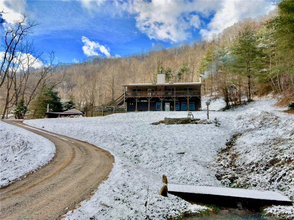 951 Price Town Road Clyde, NC 28721 - Photo 35 of 36 a view of a house with a snow on the yard