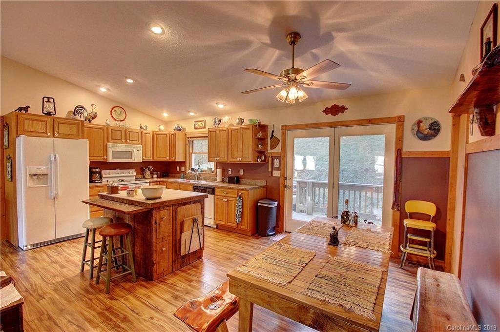 951 Price Town Road Clyde, NC 28721 - Photo 5 of 36 a view of a kitchen and dining room