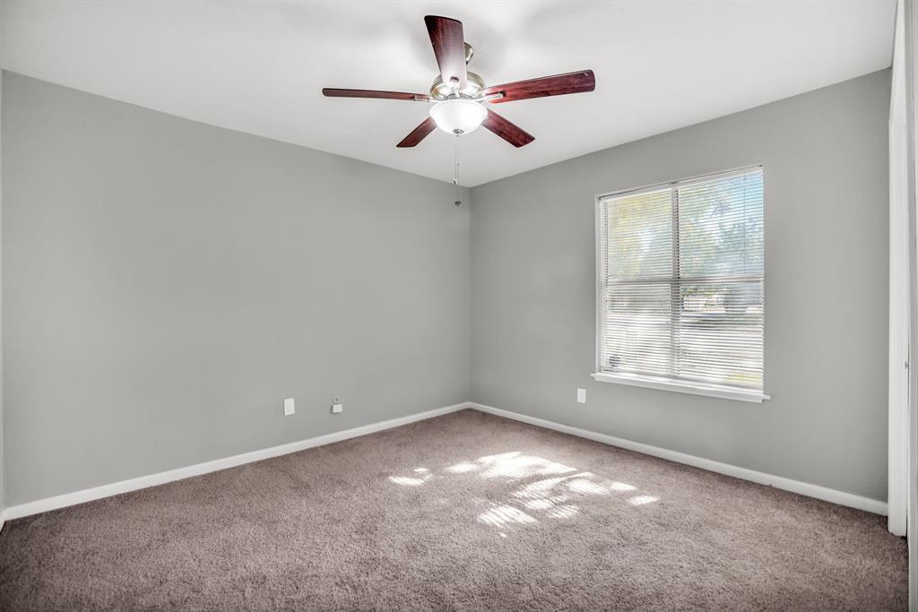 13769 Brookgreen Circle Dallas, TX 75240 - Photo 15 of 18 an empty room with windows and fan