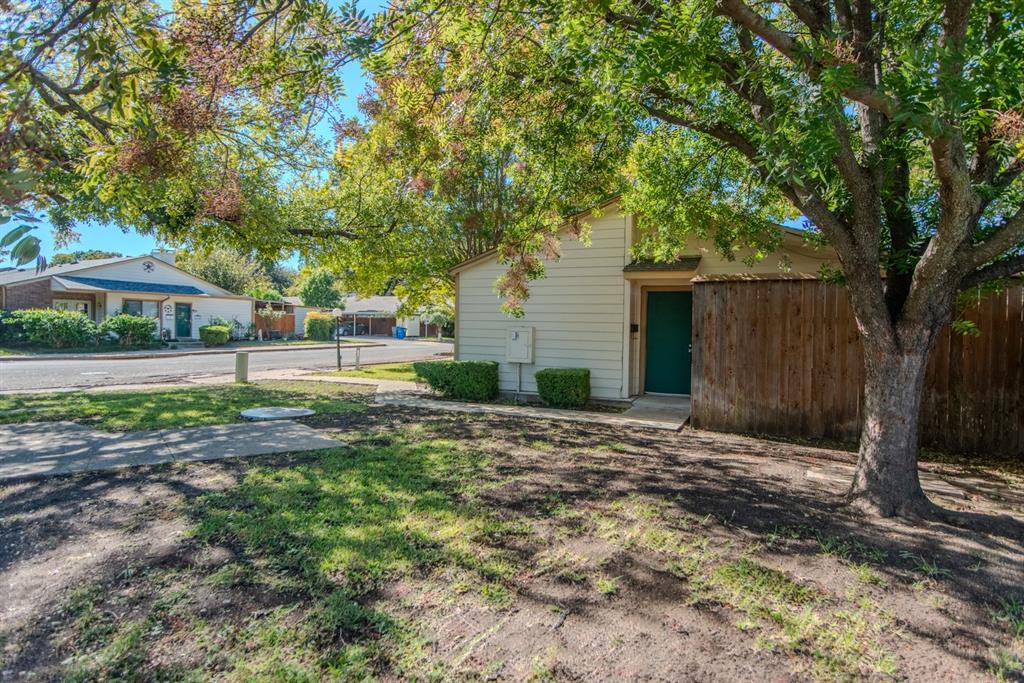 13769 Brookgreen Circle Dallas, TX 75240 - Photo 2 of 18 a view of a yard with plants and trees