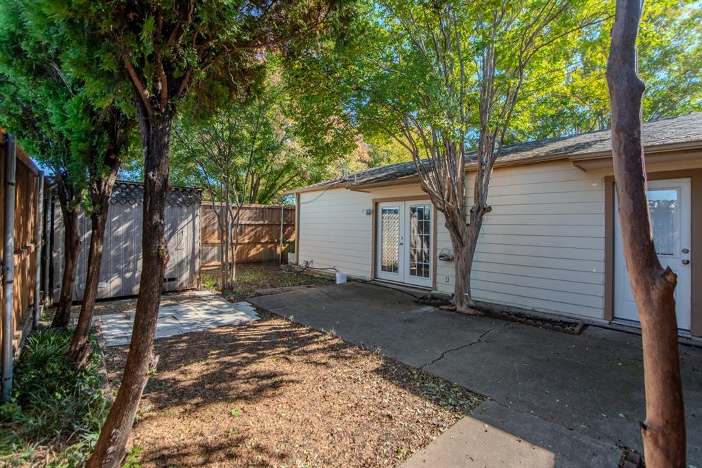 13769 Brookgreen Circle Dallas, TX 75240 - Photo 5 of 18 a view of a house with a tree in the background