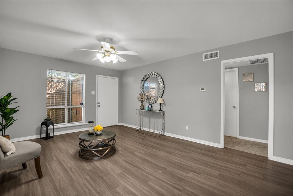 13769 Brookgreen Circle Dallas, TX 75240 - Photo 6 of 18 a living room with furniture and wooden floor
