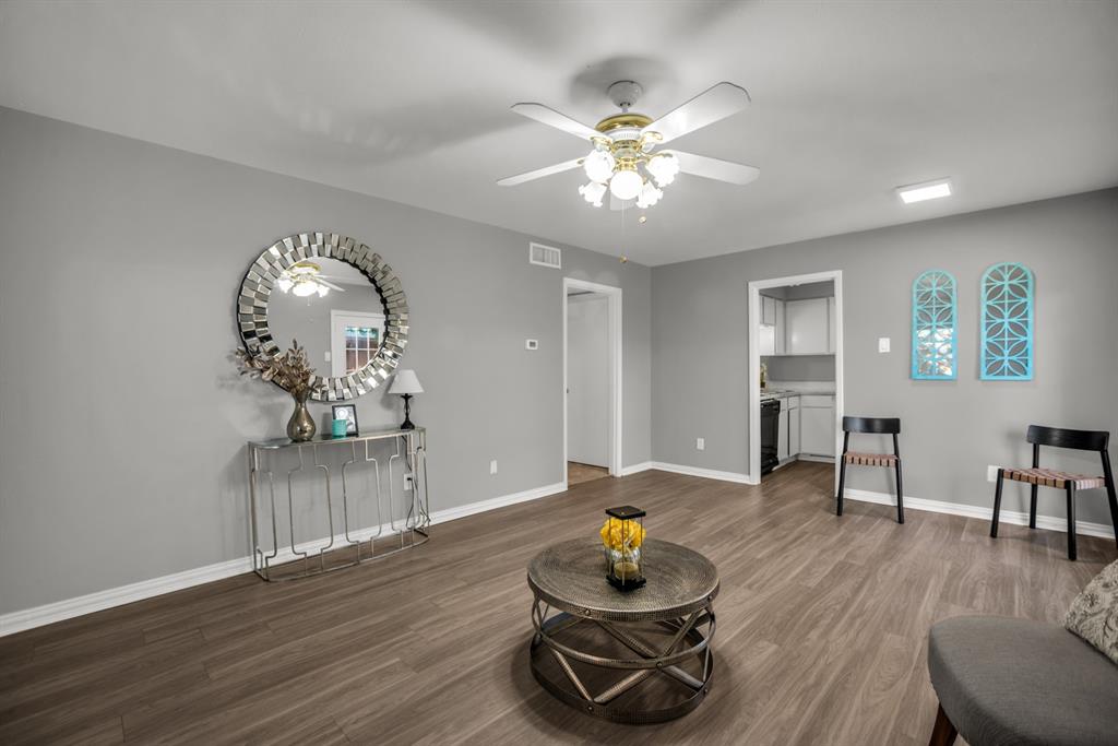 13769 Brookgreen Circle Dallas, TX 75240 - Photo 7 of 18 a living room with furniture and wooden floor