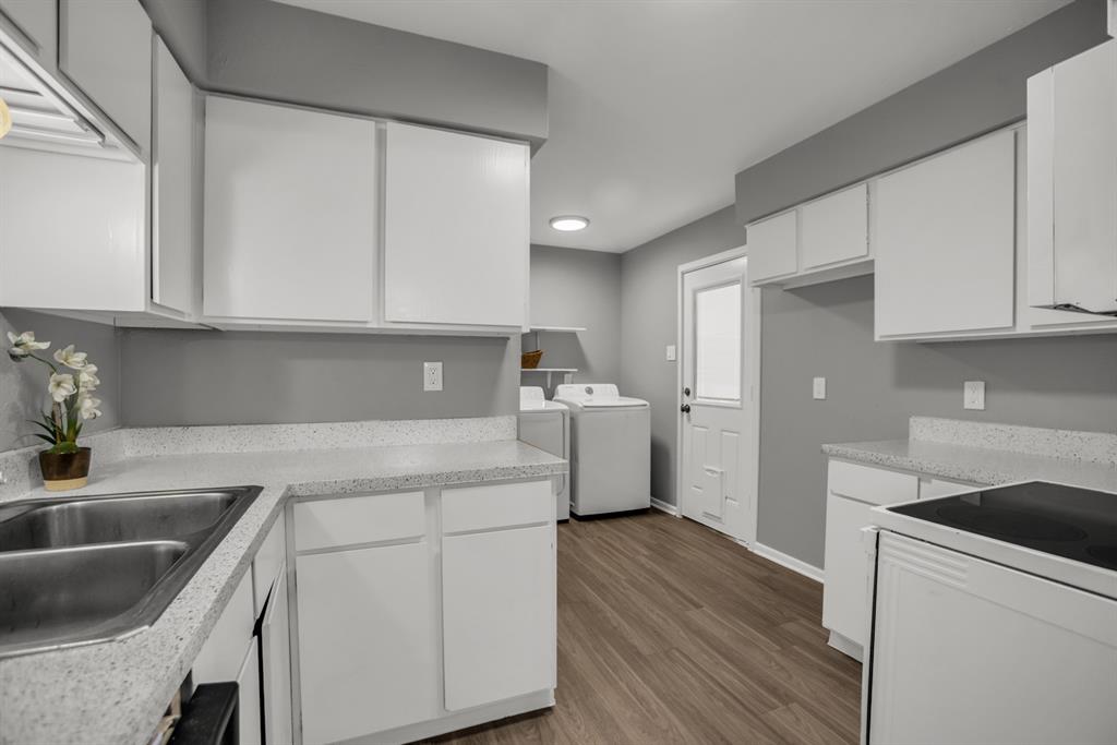 13769 Brookgreen Circle Dallas, TX 75240 - Photo 9 of 18 a kitchen with a sink dishwasher a stove top oven a refrigerator and cabinets