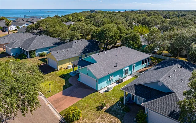 an aerial view of a house with a garden
