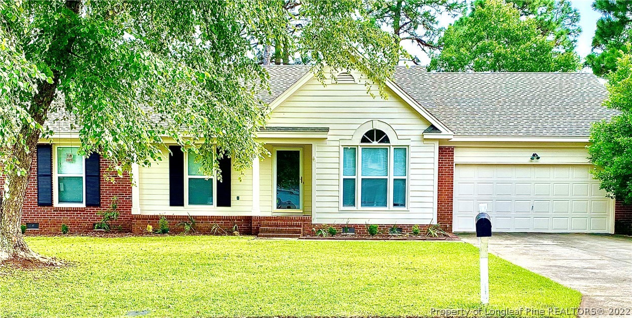 407 Larchmont Road Fayetteville, NC 28311 - Photo 1 of 16 a view of a house with a swimming pool