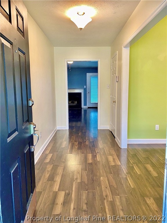 407 Larchmont Road Fayetteville, NC 28311 - Photo 3 of 16 a view of empty room with wooden floor and fan