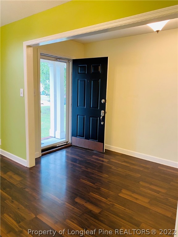 407 Larchmont Road Fayetteville, NC 28311 - Photo 5 of 16 a view of an empty room with wooden floor and closet