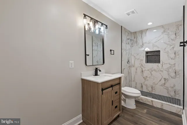 front view of a house with a tree