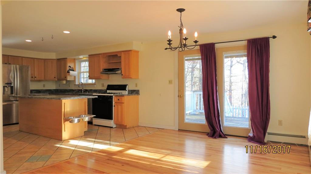 191 Edes Falls Road Naples, ME 04055 - Photo 5 of 33 Kitchen and dining area. Sliders...
