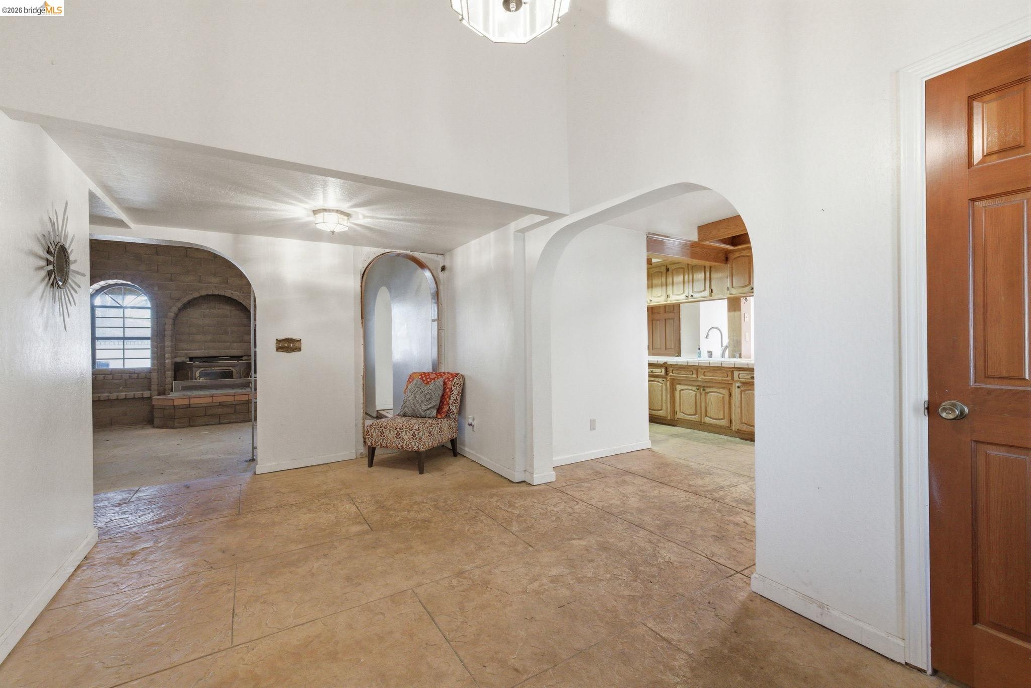 23608 Porcina Way Columbia, CA 95310 - Photo 31 of 51 Corridor featuring a high ceiling and arched walkways