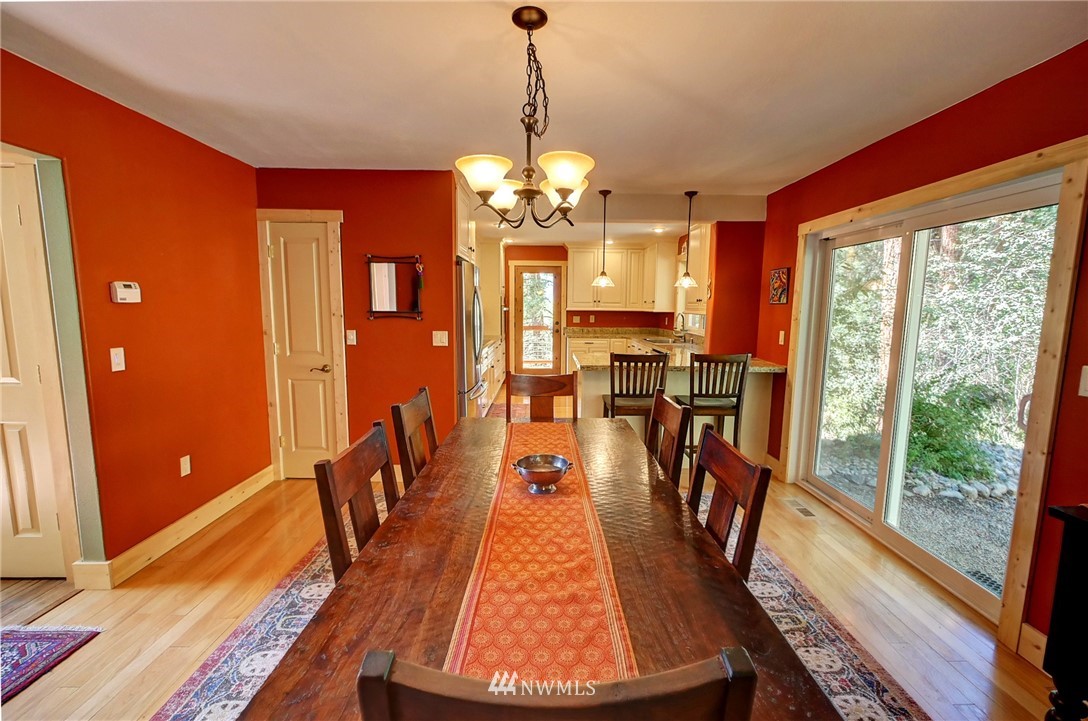 41 Trillium Road Winthrop, WA 98862 - Photo 16 of 39 a view of a dining room with furniture window and wooden floor