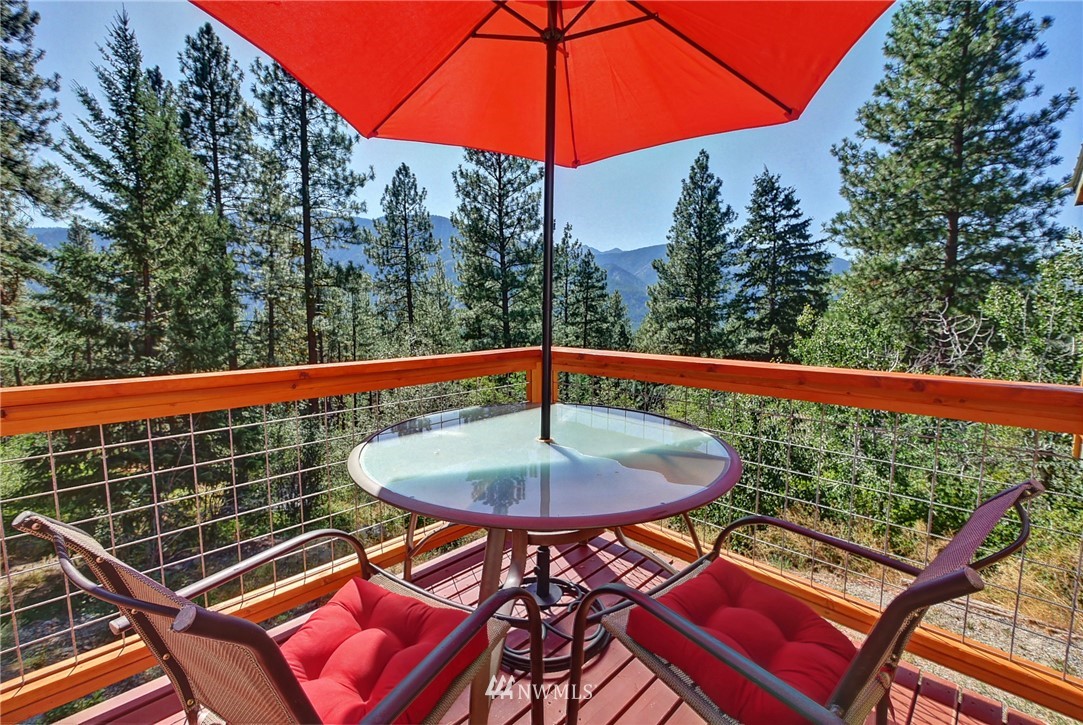 41 Trillium Road Winthrop, WA 98862 - Photo 3 of 39 a view of a swimming pool with a patio
